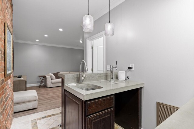 715 Forest Ave, Chattanooga, TN 37405 - kitchen featuring ornamental molding, dark brown cabinetry, open floor plan, light countertops, and recessed lighting