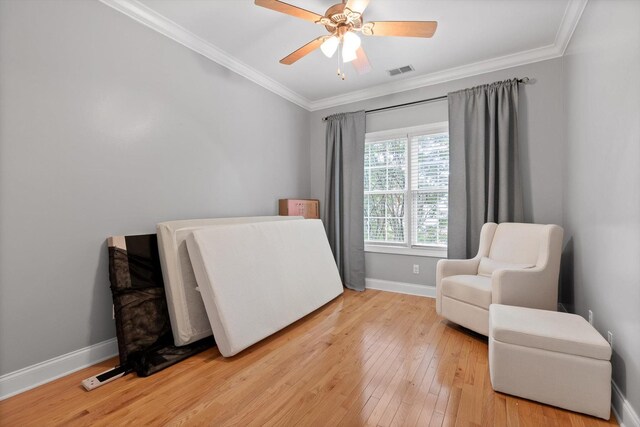 715 Forest Ave, Chattanooga, TN 37405 - living area with ornamental molding, light wood-style floors, and ceiling fan