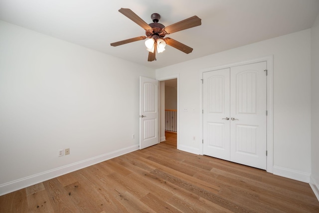 8539 Lexie Ln, Ooltewah, TN 37363 - unfurnished bedroom featuring light wood finished floors, a closet, and ceiling fan