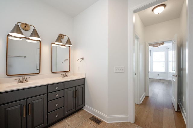 8539 Lexie Ln, Ooltewah, TN 37363 - bathroom featuring double vanity and baseboards
