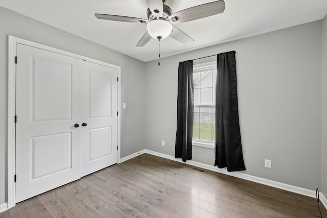 521 5th Ave N, Lewisburg, TN 37091 - unfurnished bedroom with wood finished floors, a closet, and ceiling fan