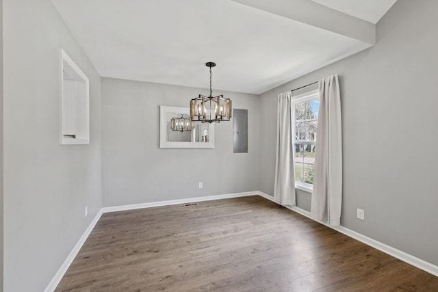 521 5th Ave N, Lewisburg, TN 37091 - empty room featuring wood finished floors, a chandelier, and electric panel