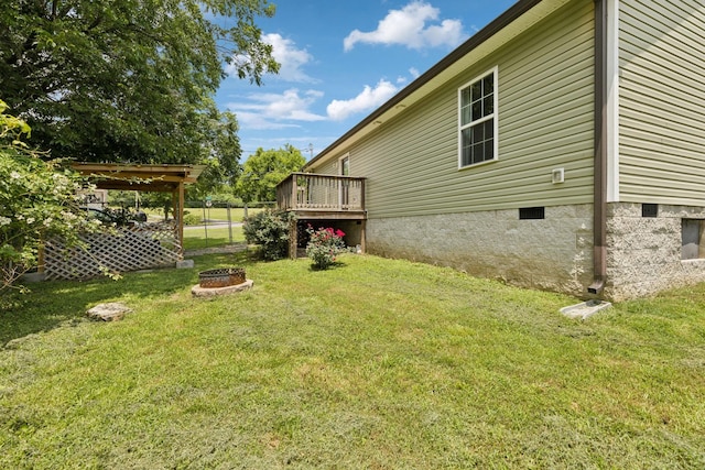 521 5th Ave N, Lewisburg, TN 37091 - view of grassy yard featuring a fire pit and a deck