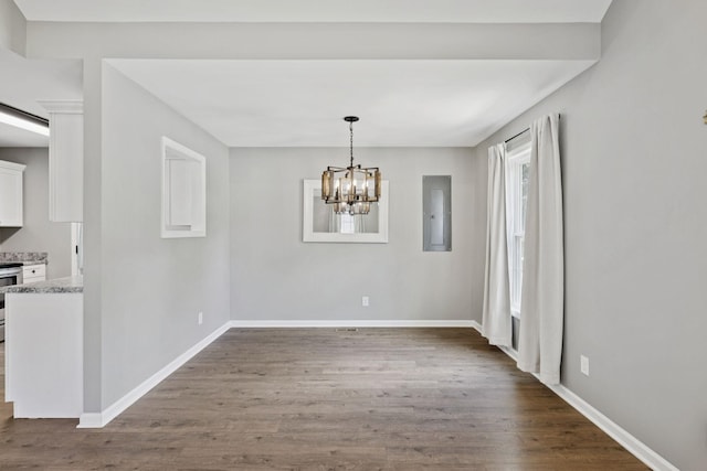 521 5th Ave N, Lewisburg, TN 37091 - unfurnished dining area with dark wood-style flooring, electric panel, and a chandelier