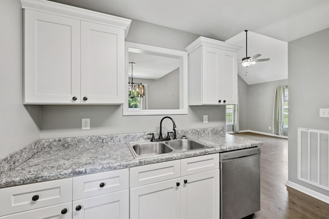 521 5th Ave N, Lewisburg, TN 37091 - kitchen featuring stainless steel dishwasher, dark wood-style floors, white cabinets, light countertops, and vaulted ceiling