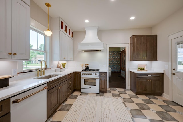 414 W College St, Dickson, TN 37055 - kitchen featuring white appliances, custom exhaust hood, plenty of natural light, light countertops, and recessed lighting