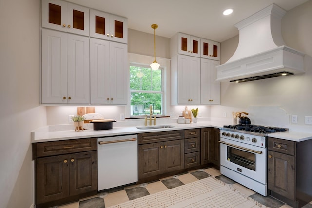 414 W College St, Dickson, TN 37055 - kitchen with white appliances, custom exhaust hood, light countertops, dark brown cabinets, and recessed lighting
