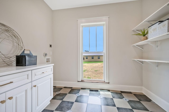 414 W College St, Dickson, TN 37055 - laundry area with hookup for an electric dryer, plenty of natural light, and tile patterned floors