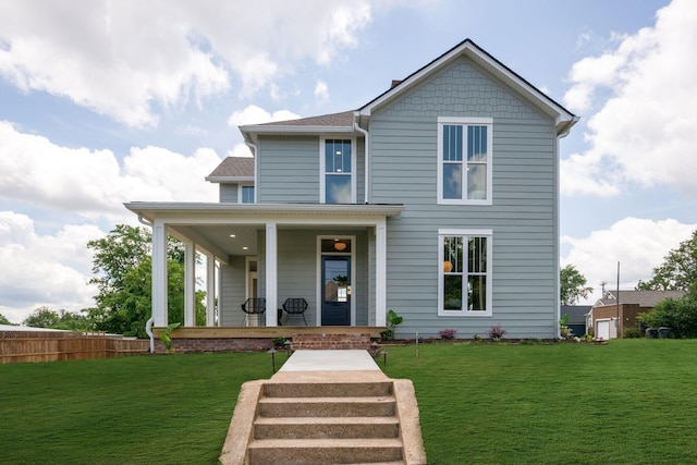 414 W College St, Dickson, TN 37055 - view of front of home with covered porch, a front lawn, and a shingled roof