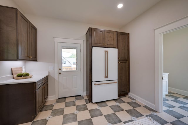 414 W College St, Dickson, TN 37055 - kitchen featuring freestanding refrigerator, light floors, light countertops, dark brown cabinetry, and recessed lighting