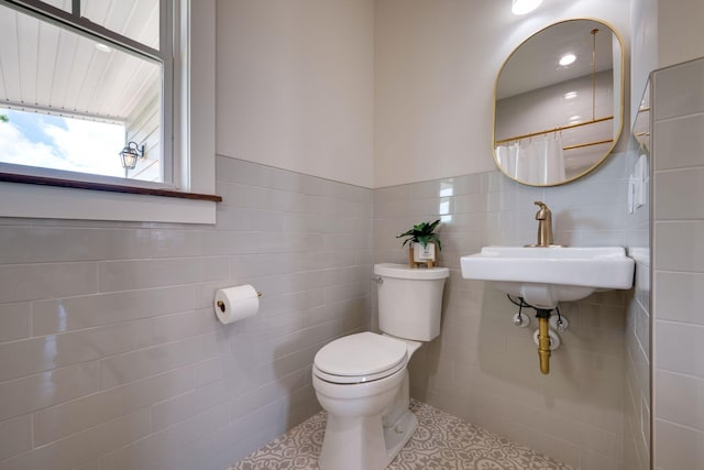 414 W College St, Dickson, TN 37055 - full bathroom featuring tile walls, tile patterned flooring, and curtained shower