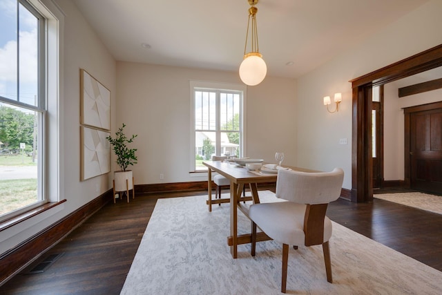 414 W College St, Dickson, TN 37055 - dining area with healthy amount of natural light, dark wood finished floors, and a chandelier
