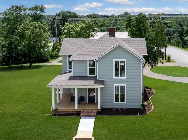 414 W College St, Dickson, TN 37055 - view of front of home featuring a porch, a chimney, a shingled roof, and a front lawn