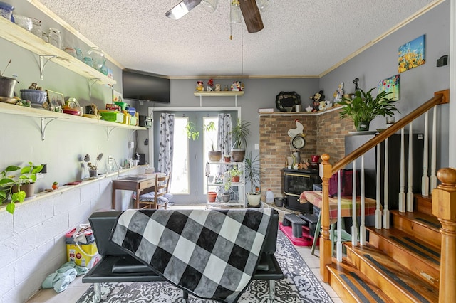 2802 Canterbury Dr, Springfield, TN 37172 - living area with a textured ceiling, ceiling fan, stairway, ornamental molding, and tile patterned floors