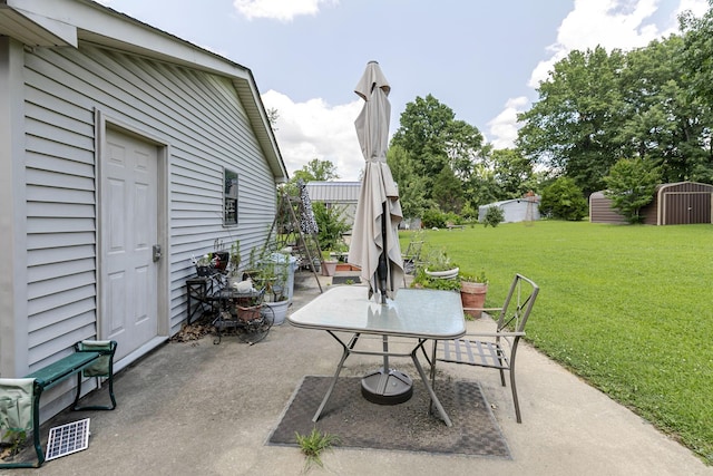 2802 Canterbury Dr, Springfield, TN 37172 - view of patio / terrace with outdoor dining space and a storage shed
