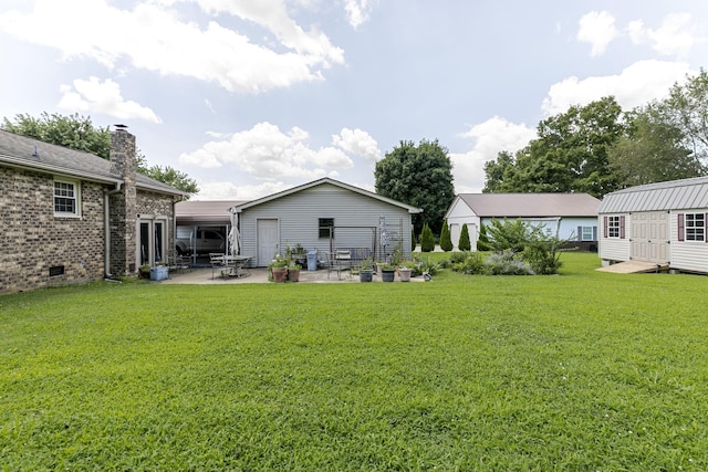 2802 Canterbury Dr, Springfield, TN 37172 - view of grassy yard with a patio area and a storage shed