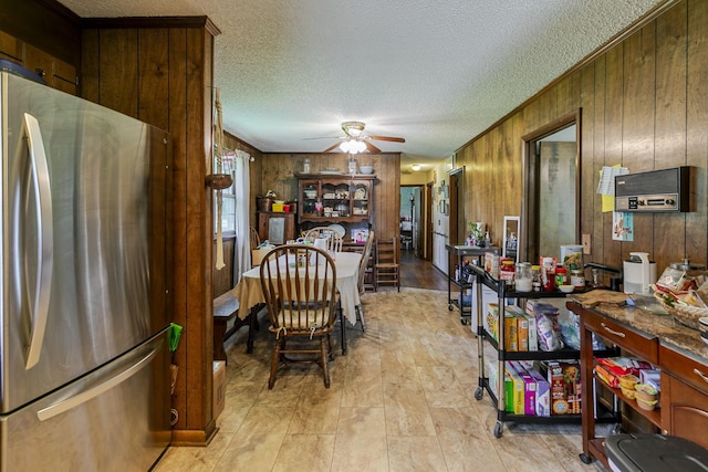 2802 Canterbury Dr, Springfield, TN 37172 - dining room featuring wooden walls, a ceiling fan, and a textured ceiling
