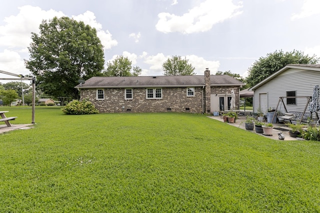 2802 Canterbury Dr, Springfield, TN 37172 - back of house featuring a patio, crawl space, a lawn, and a chimney