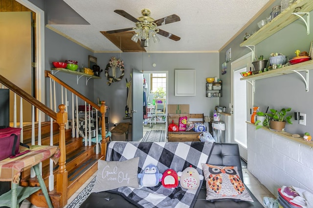 2802 Canterbury Dr, Springfield, TN 37172 - living room with a ceiling fan, ornamental molding, a textured ceiling, stairway, and attic access
