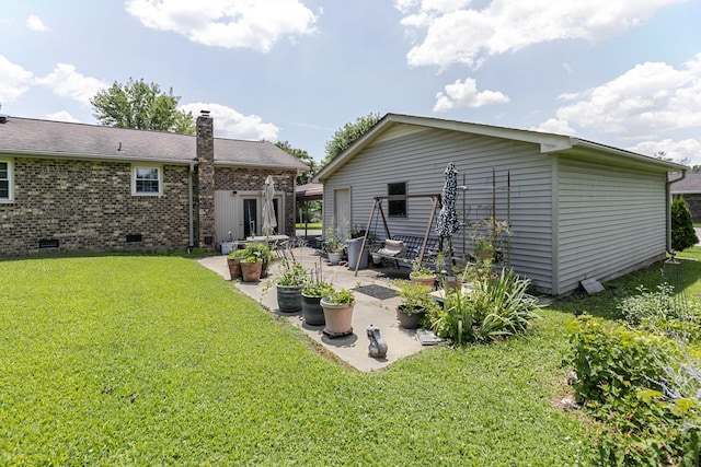 2802 Canterbury Dr, Springfield, TN 37172 - back of property with crawl space, a patio, a yard, brick siding, and a chimney