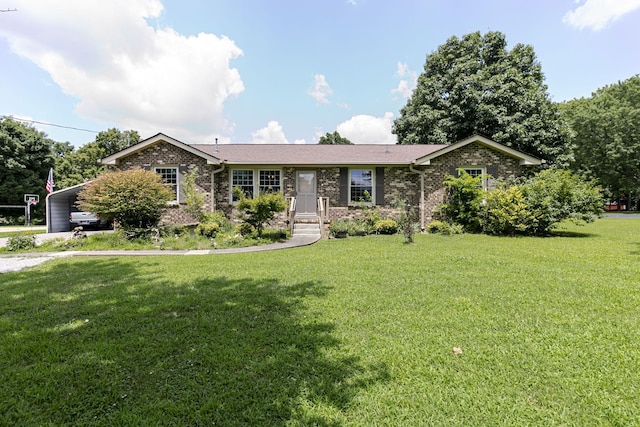 2802 Canterbury Dr, Springfield, TN 37172 - single story home with a front yard, brick siding, driveway, and an attached carport