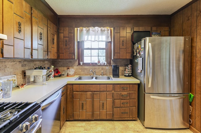 2802 Canterbury Dr, Springfield, TN 37172 - kitchen with appliances with stainless steel finishes, crown molding, light countertops, backsplash, and a textured ceiling