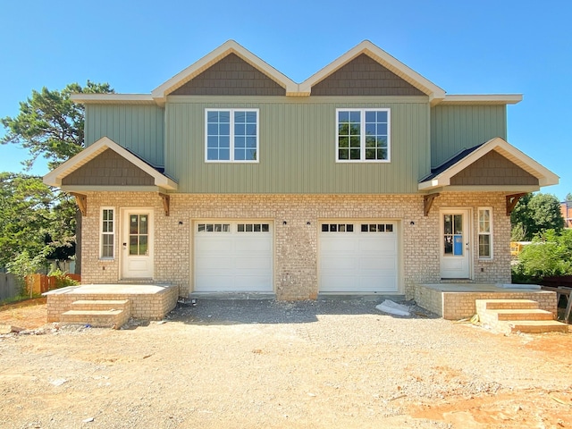 305 Towles Ave Unit B, Mcminnville, TN 37110 - view of front of property featuring a garage, driveway, and brick siding