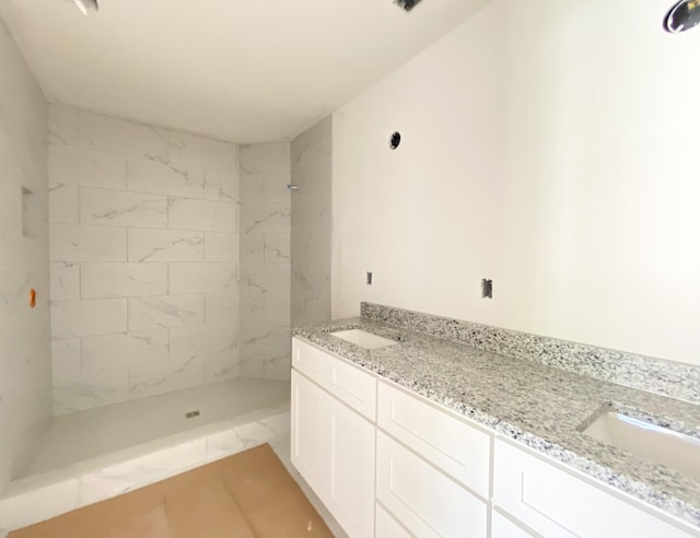 305 Towles Ave Unit A, Mcminnville, TN 37110 - bathroom with double vanity, tiled shower, and marble look tiles