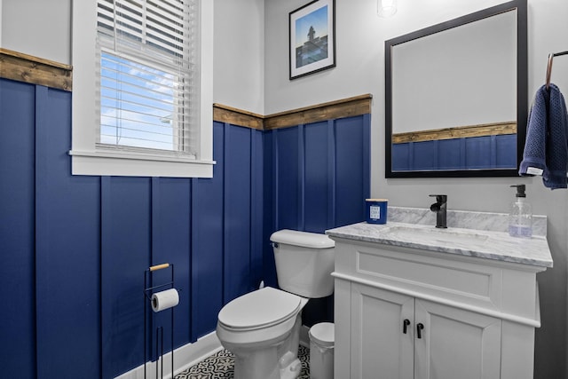 1014 Douglas Ct, Dickson, TN 37055 - half bath featuring vanity, a decorative wall, and wainscoting