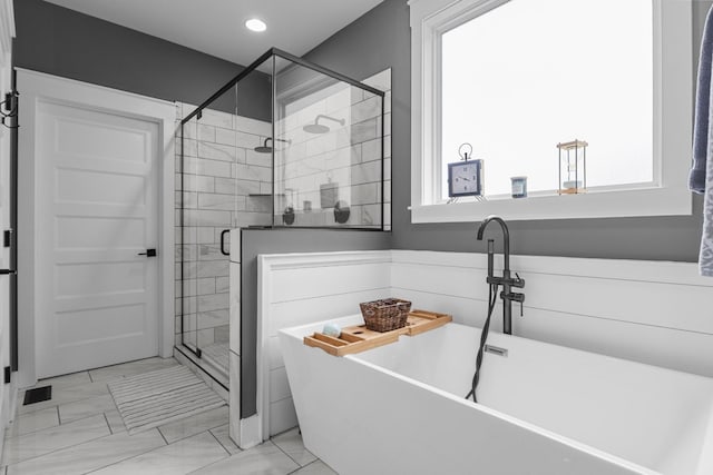 1014 Douglas Ct, Dickson, TN 37055 - bathroom with a soaking tub, a shower stall, marble finish flooring, and recessed lighting