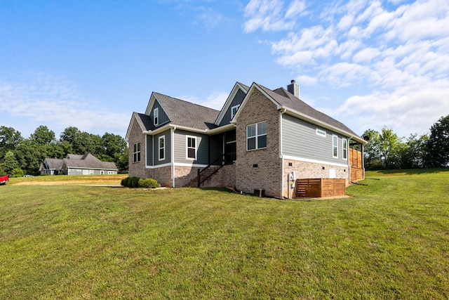 1014 Douglas Ct, Dickson, TN 37055 - view of front facade featuring brick siding, a front yard, and a chimney