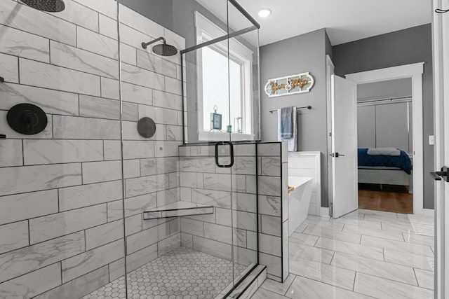 1014 Douglas Ct, Dickson, TN 37055 - full bath featuring ensuite bath, a soaking tub, a shower stall, and marble look tile flooring