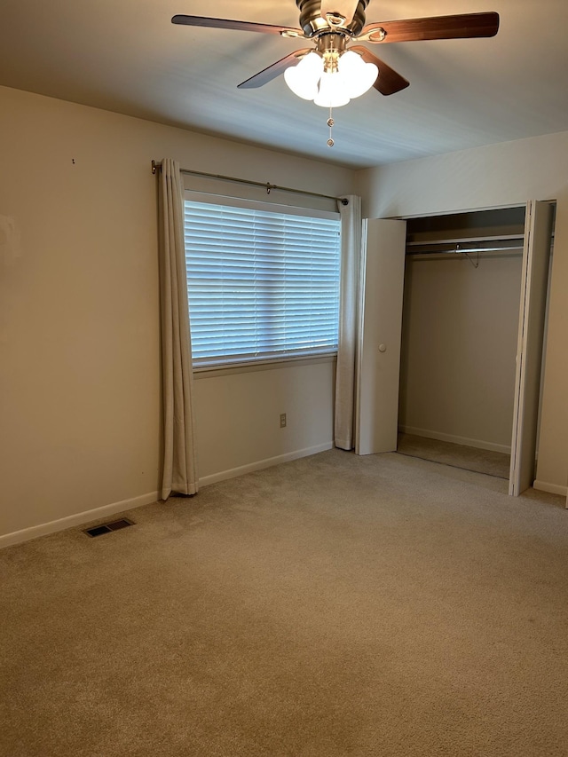 604 Granville Rd Unit 604, Franklin, TN 37064 - unfurnished bedroom featuring light carpet, a closet, and a ceiling fan