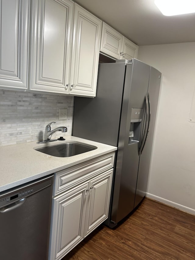 604 Granville Rd Unit 604, Franklin, TN 37064 - kitchen featuring stainless steel appliances, backsplash, light countertops, dark wood-style flooring, and white cabinets