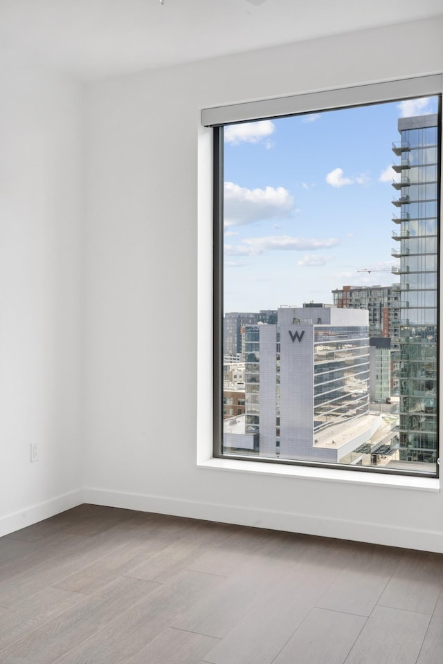 1212 Demonbreun St Unit A13 K, Nashville, TN 37203 - unfurnished room with wood finished floors and a view of city