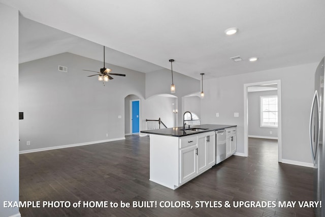 1988 Flats Rd, Cunningham, TN 37052 - kitchen with stainless steel appliances, arched walkways, dark countertops, white cabinets, and ceiling fan