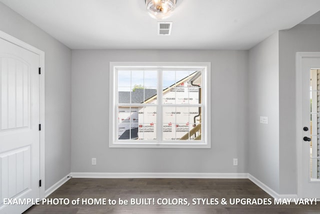 1988 Flats Rd, Cunningham, TN 37052 - unfurnished dining area featuring dark wood-type flooring and baseboards