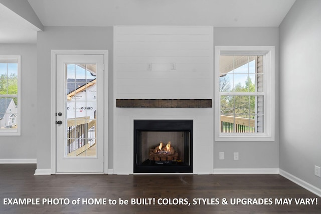 1988 Flats Rd, Cunningham, TN 37052 - unfurnished living room with wood finished floors and a fireplace