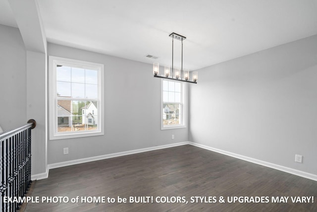 1988 Flats Rd, Cunningham, TN 37052 - unfurnished room with healthy amount of natural light, dark wood-style floors, and a chandelier