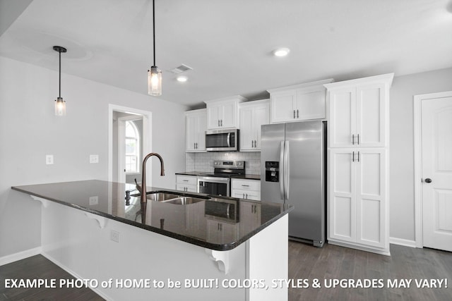 1988 Flats Rd, Cunningham, TN 37052 - kitchen with appliances with stainless steel finishes, white cabinetry, a kitchen bar, dark wood-style floors, and backsplash