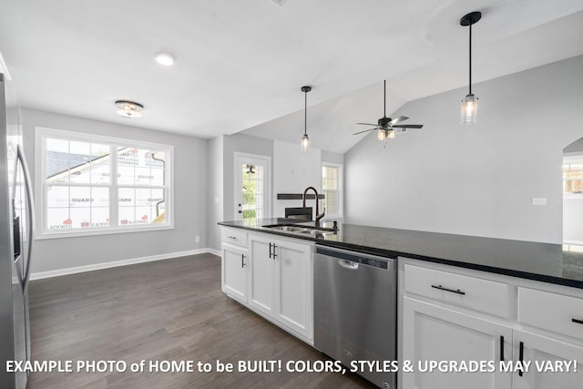 1988 Flats Rd, Cunningham, TN 37052 - kitchen featuring appliances with stainless steel finishes, dark countertops, a ceiling fan, dark wood finished floors, and white cabinetry