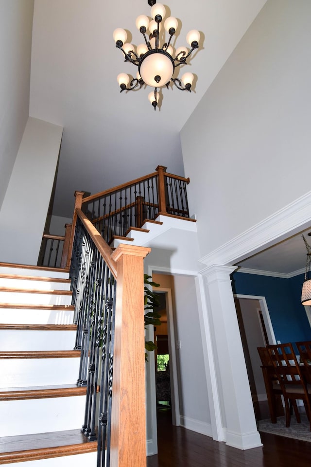 216 Honeysuckle Ln, Lebanon, TN 37087 - stairway featuring a chandelier, a towering ceiling, and wood finished floors
