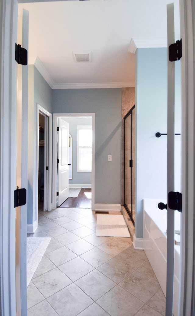 216 Honeysuckle Ln, Lebanon, TN 37087 - bathroom with a stall shower, ornamental molding, a garden tub, and tile patterned flooring