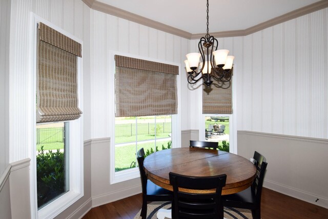 216 Honeysuckle Ln, Lebanon, TN 37087 - dining space featuring a chandelier, dark wood finished floors, ornamental molding, and wallpapered walls