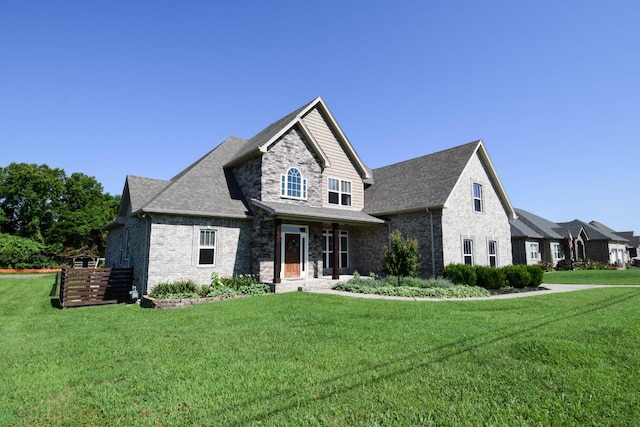 216 Honeysuckle Ln, Lebanon, TN 37087 - view of front of house featuring a front lawn, brick siding, and roof with shingles