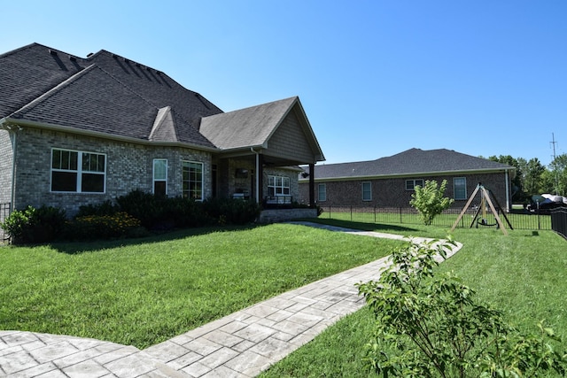 216 Honeysuckle Ln, Lebanon, TN 37087 - rear view of property featuring brick siding and a shingled roof