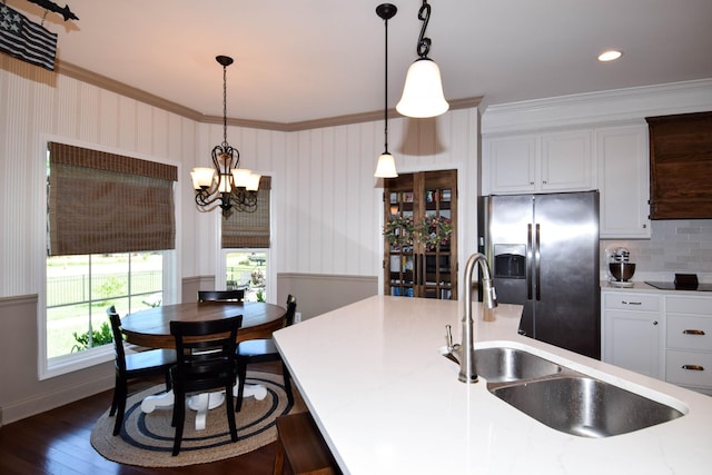216 Honeysuckle Ln, Lebanon, TN 37087 - kitchen featuring stainless steel fridge with ice dispenser, ornamental molding, a chandelier, hanging light fixtures, and dark wood finished floors