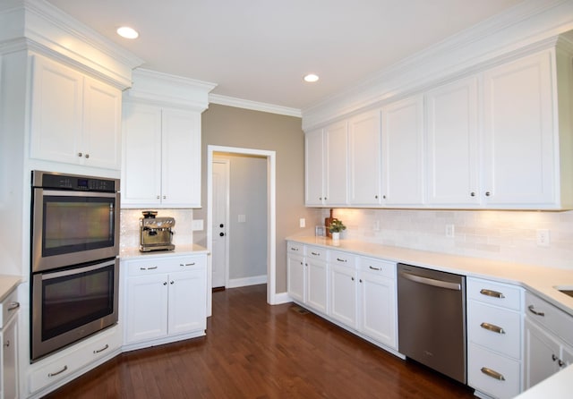 216 Honeysuckle Ln, Lebanon, TN 37087 - kitchen featuring appliances with stainless steel finishes, white cabinets, tasteful backsplash, light countertops, and recessed lighting