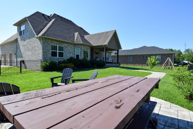 216 Honeysuckle Ln, Lebanon, TN 37087 - back of property featuring brick siding, roof with shingles, and a wooden deck