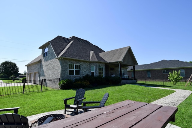 216 Honeysuckle Ln, Lebanon, TN 37087 - back of property with brick siding, a garage, and a shingled roof